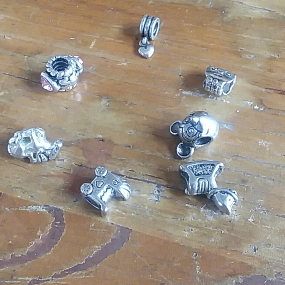7 silver Pandora beads and charms